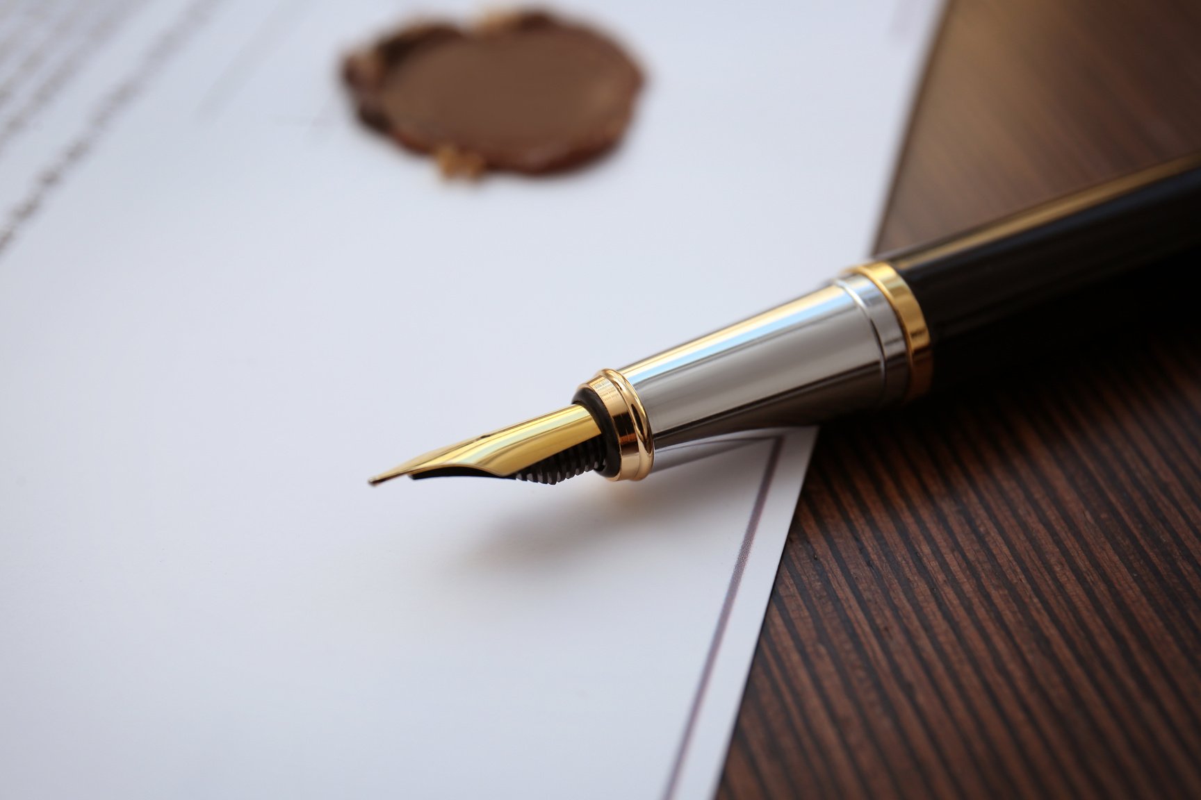 Fountain Pen and Old Notarial Wax Seal on a Document